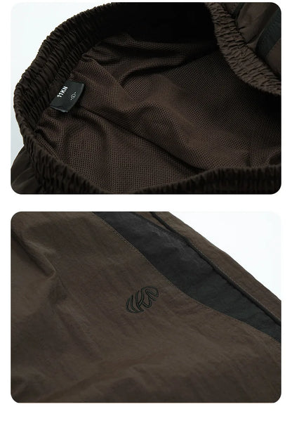 Revena™ “DriftLine” Wide-Leg Track Pants